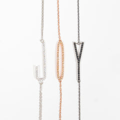 Composizione Bracciali iniziali in argento 925 brunito e zirconi neri Fofo Somani